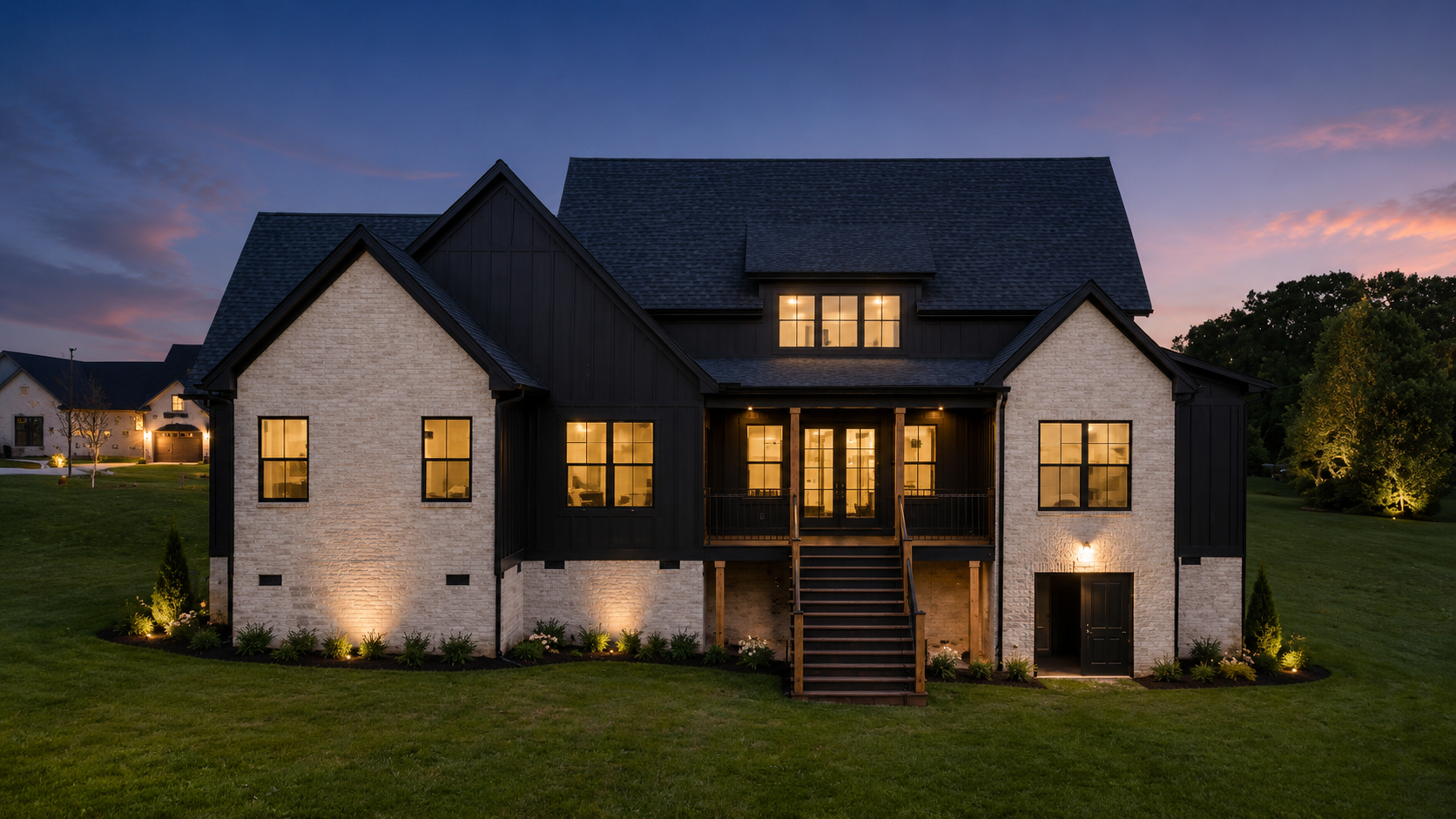 Rear elevation of a custom home at blue hour
